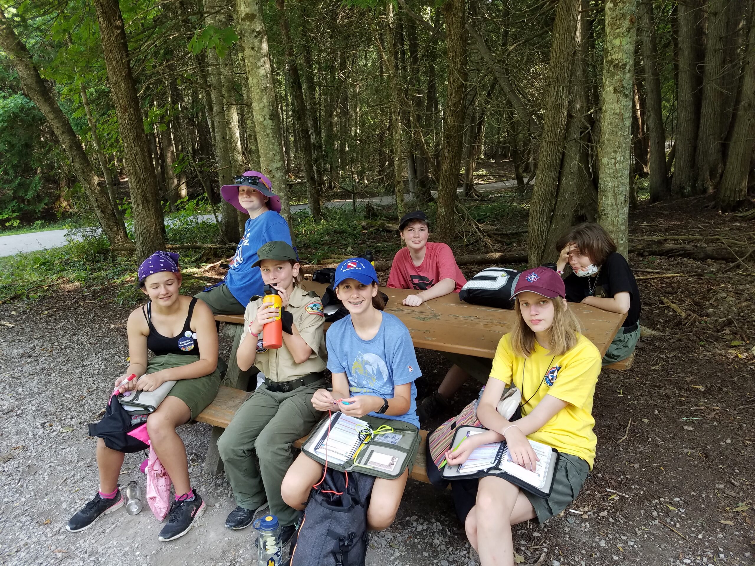 Scouts sitting around a picnic table