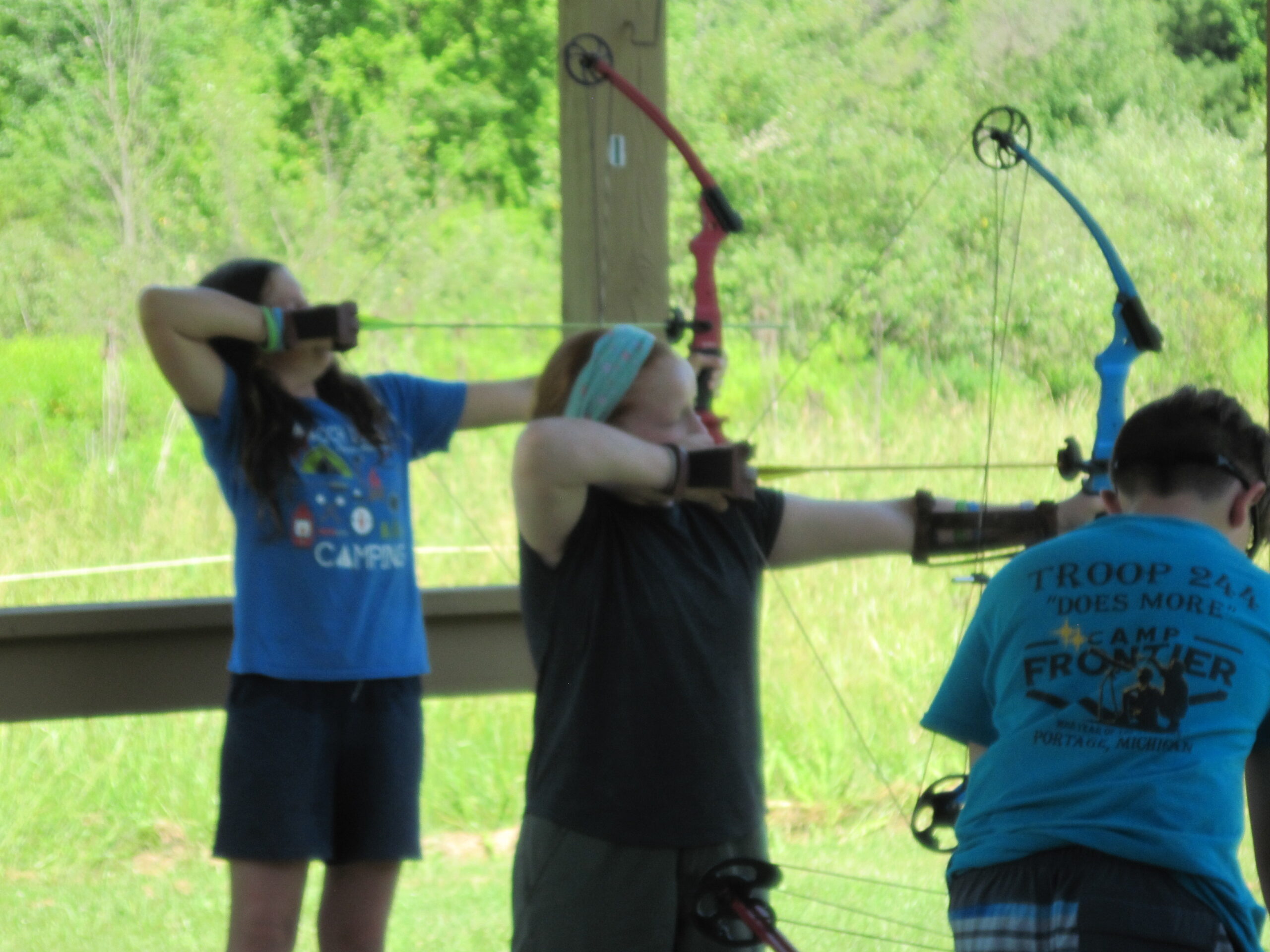 Scouts aiming bows ready to shoot their arrows