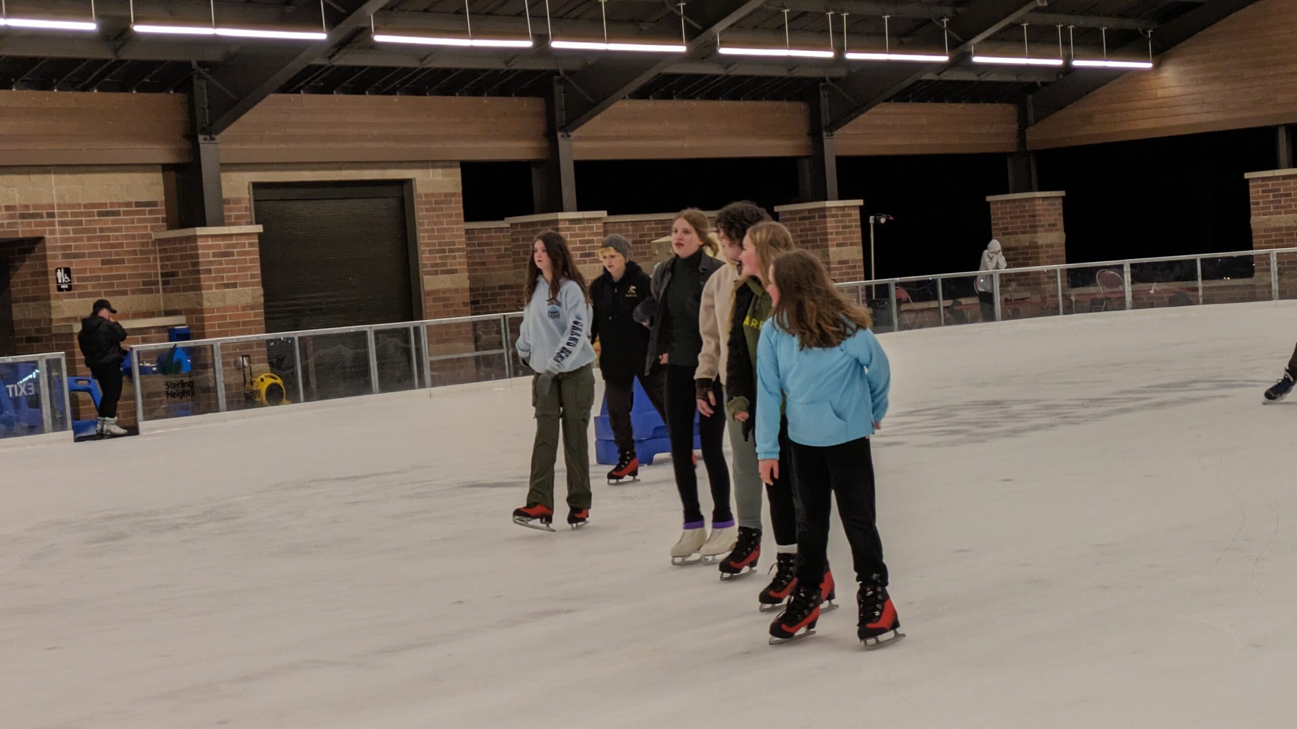 Troop in a line on the ice rink