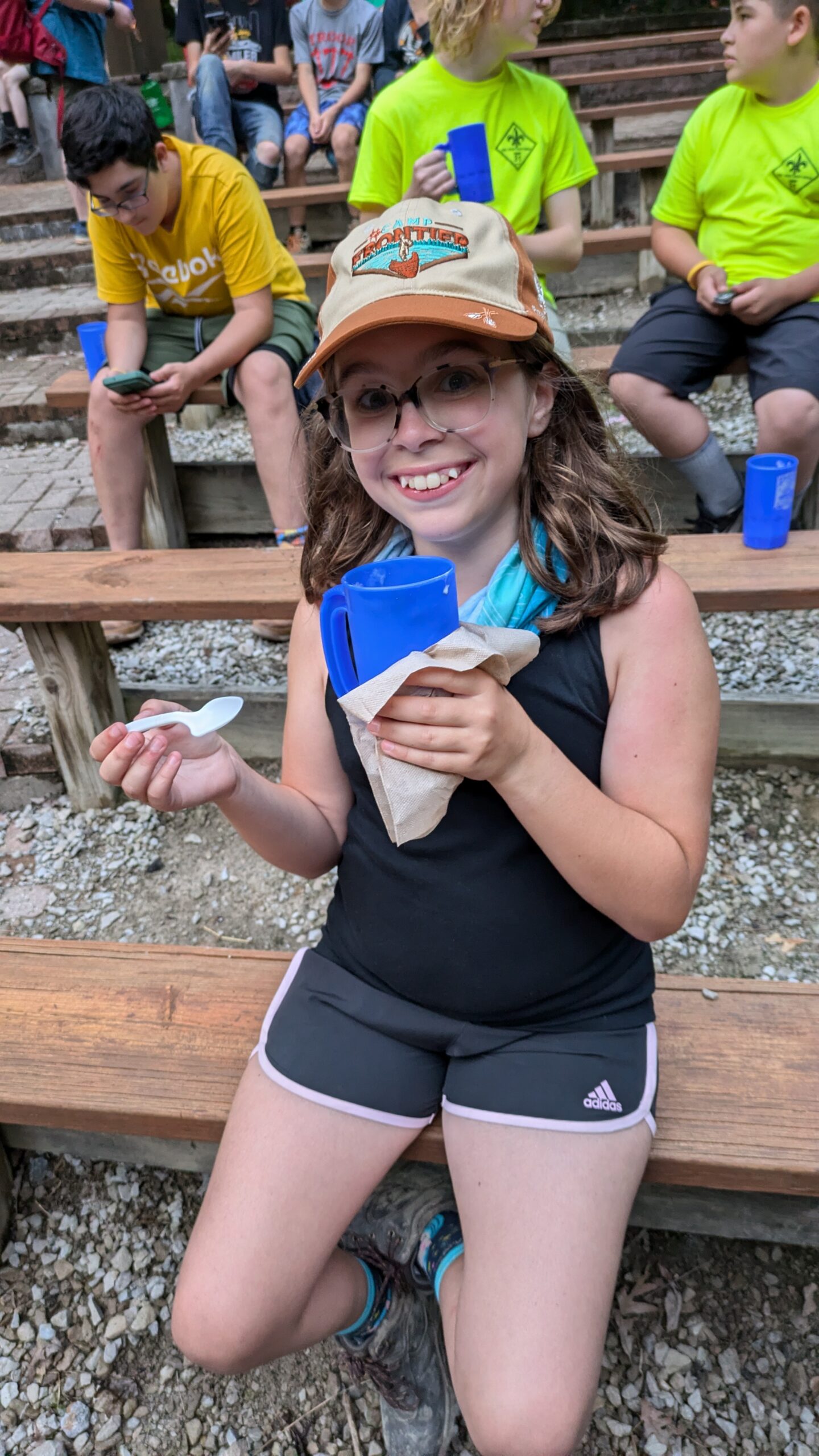 Scout eating a root beer float at camp
