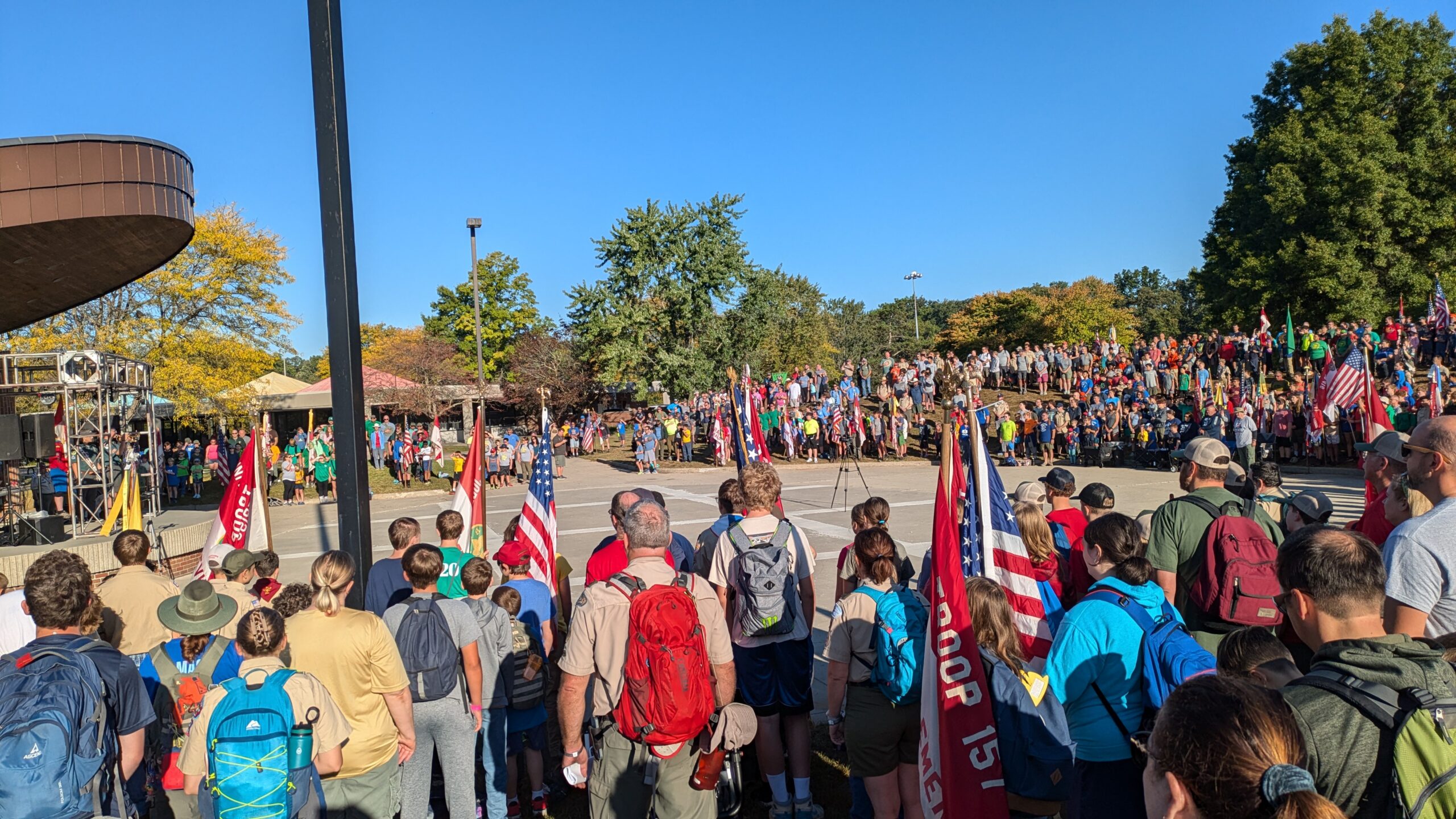 Troops gathered in a circle for a flag ceremony
